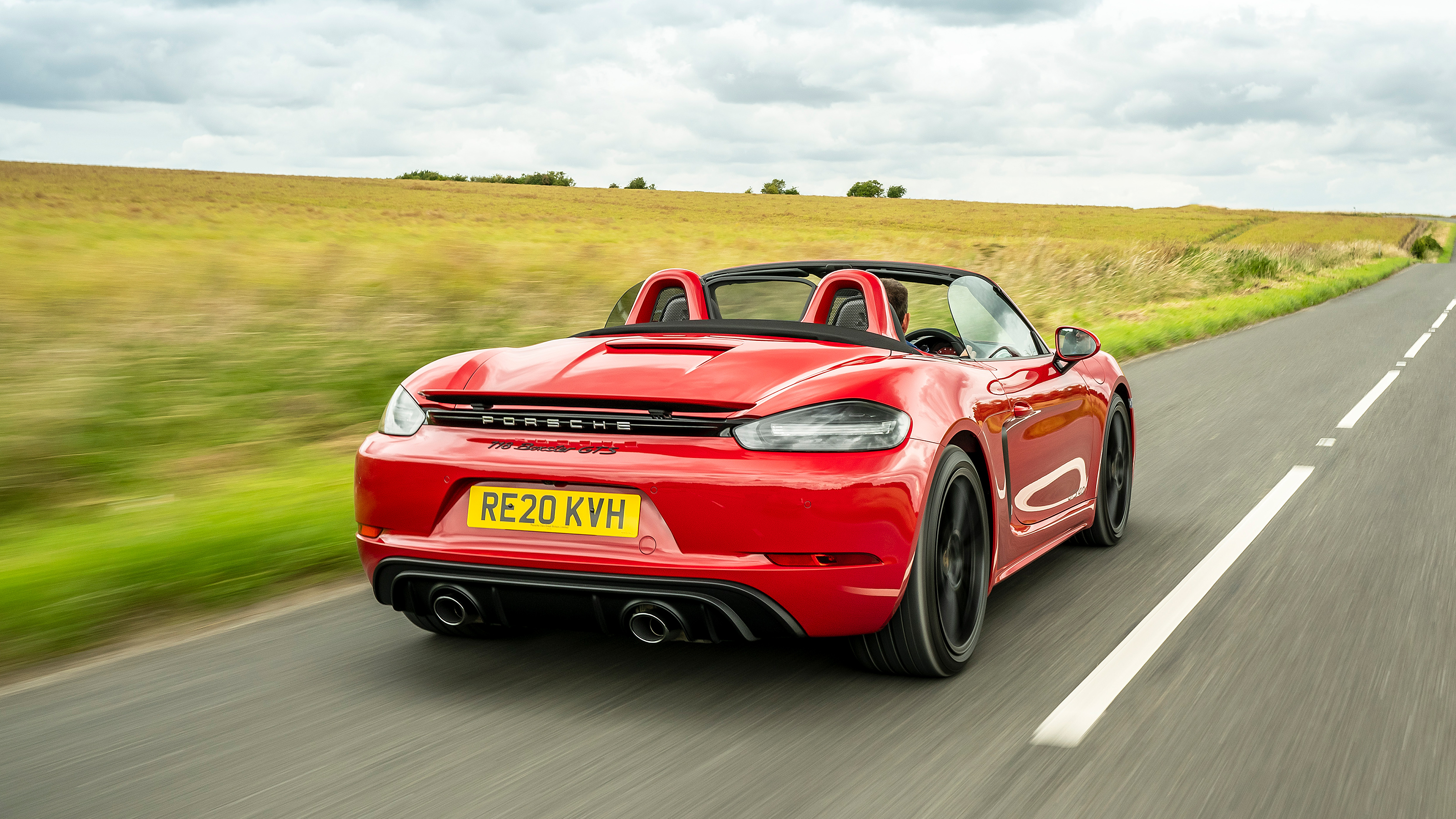 Porsche 718 Boxster convertible rear 3/4 tracking