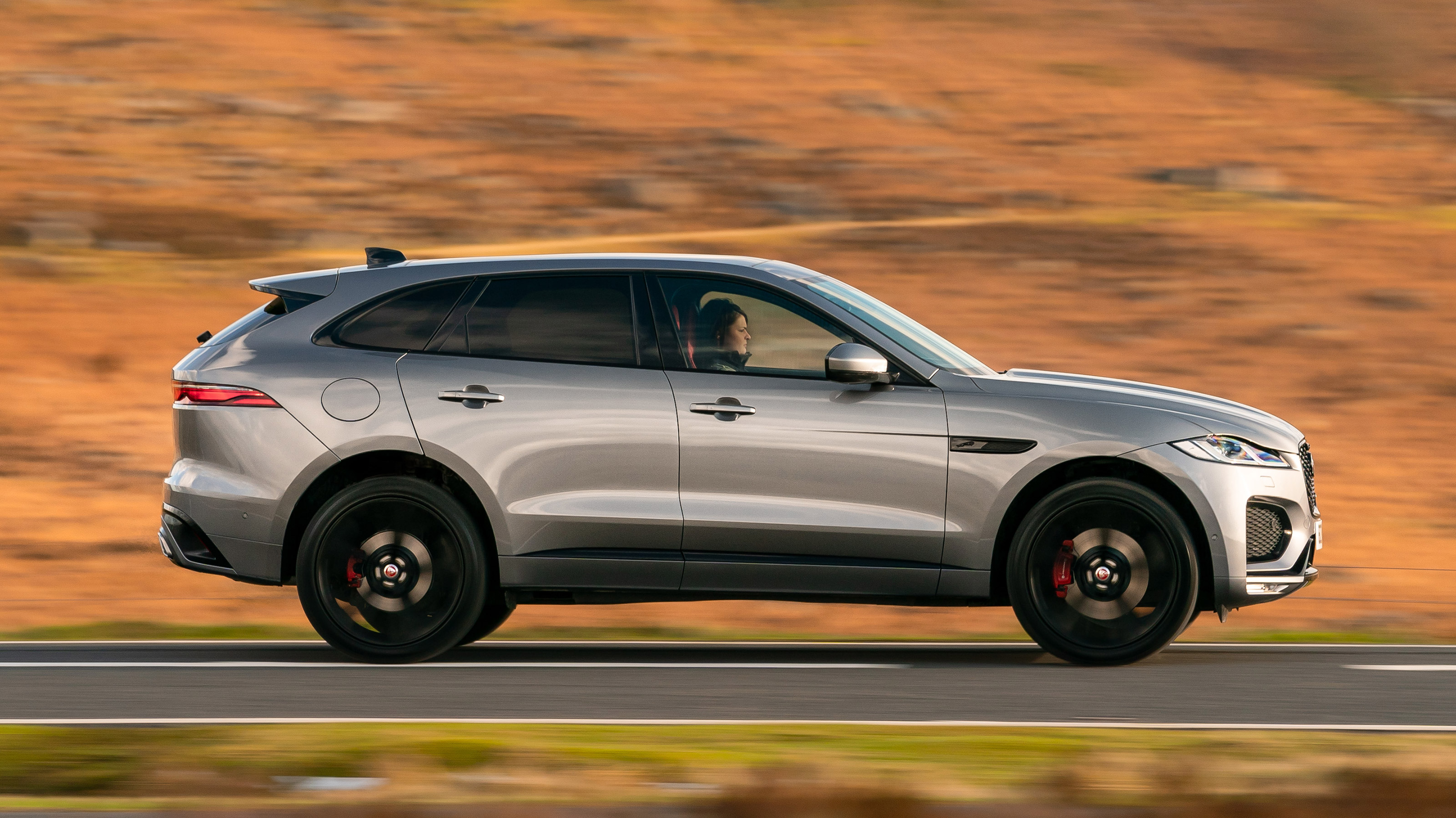 Jaguar F-Pace SUV side driving