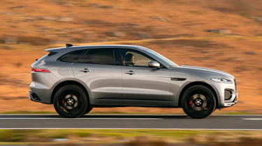 Jaguar F-Pace SUV side driving