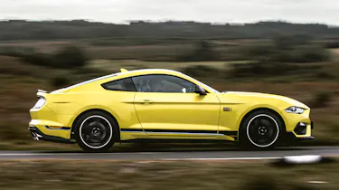 Ford Mustang Mach 1 driving - side view