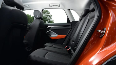 Orange Audi Q3 rear seats
