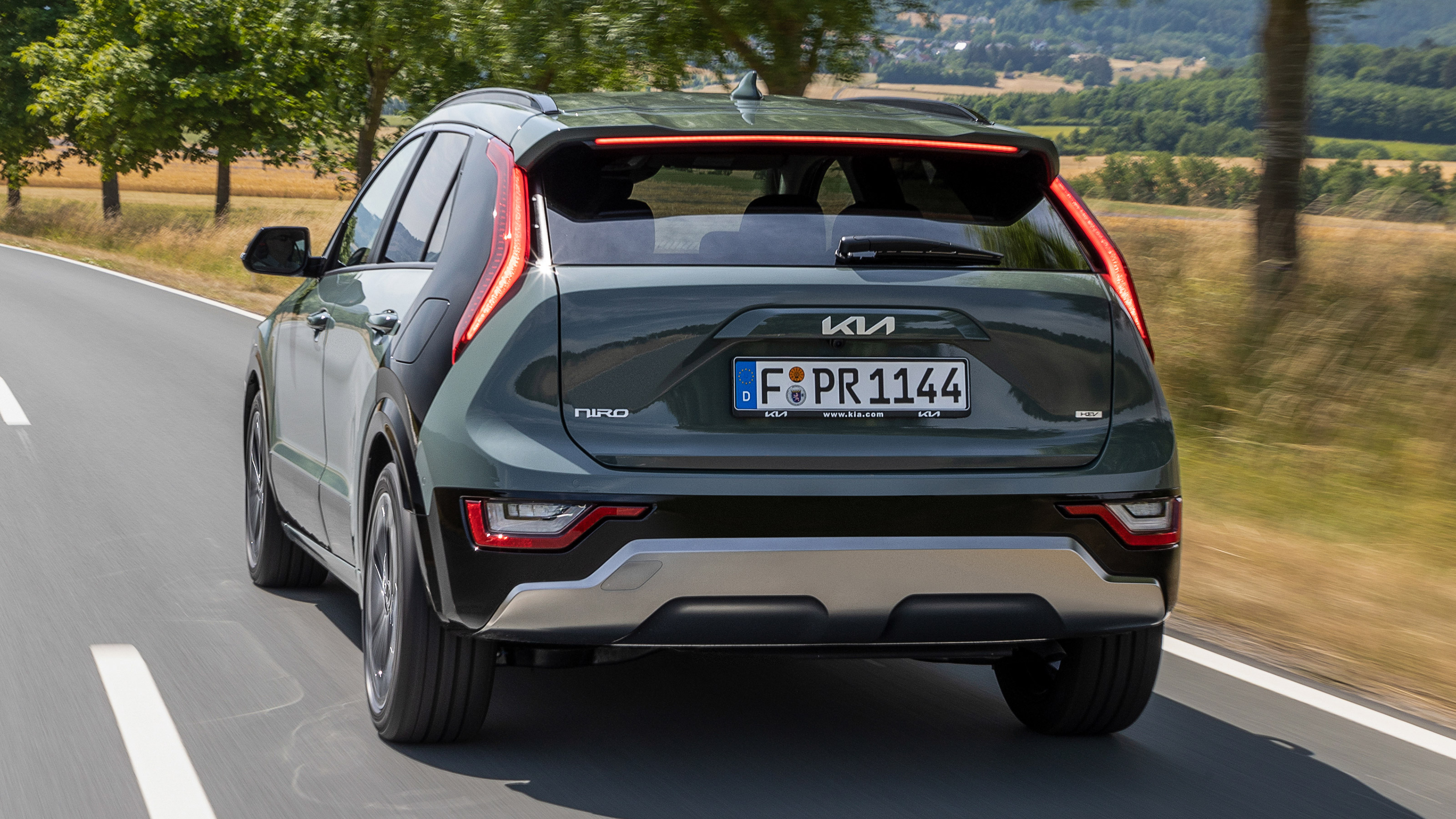 Kia Niro SUV hybrid rear 3/4 driving 