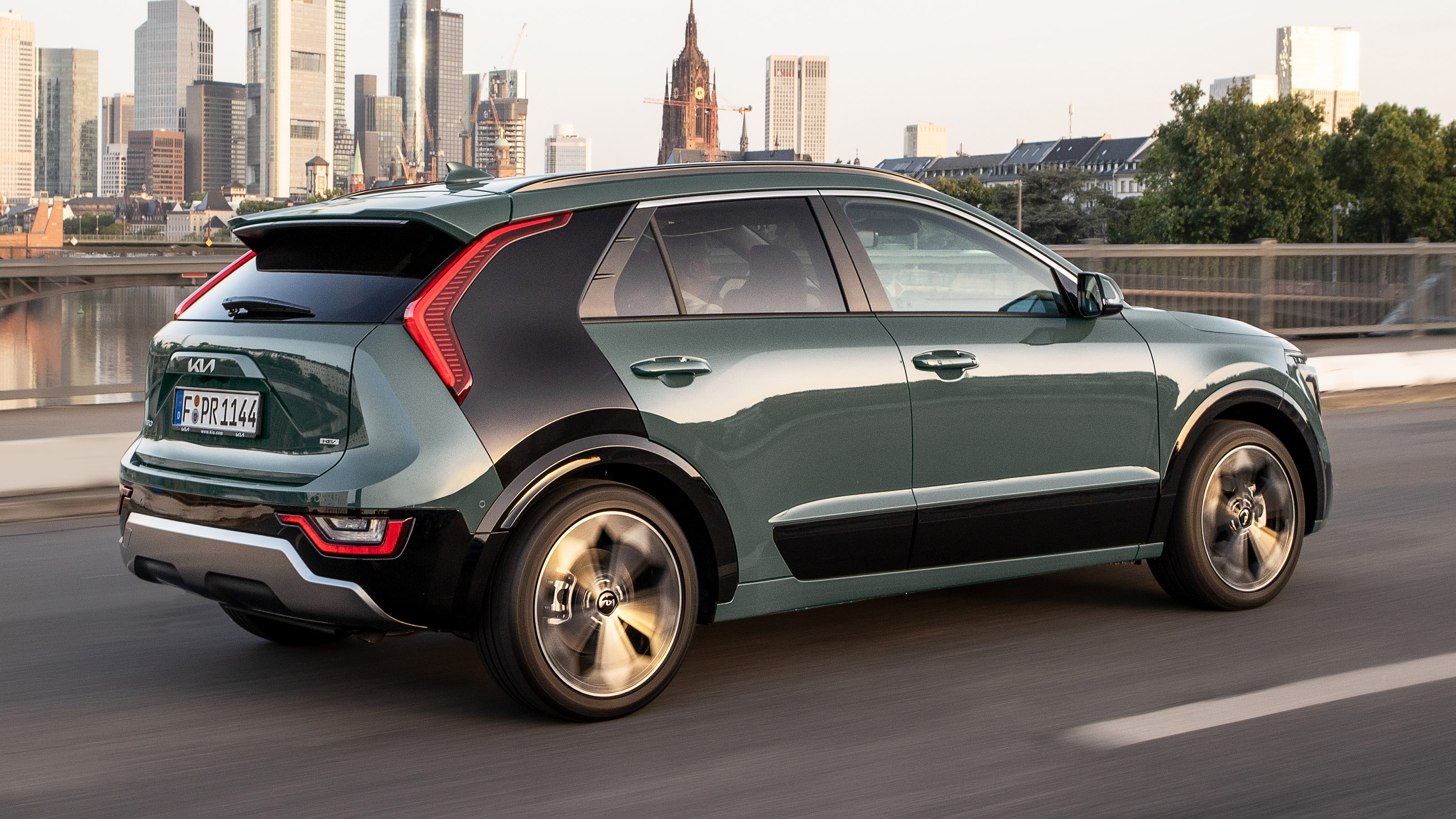 Kia Niro SUV hybrid rear side driving