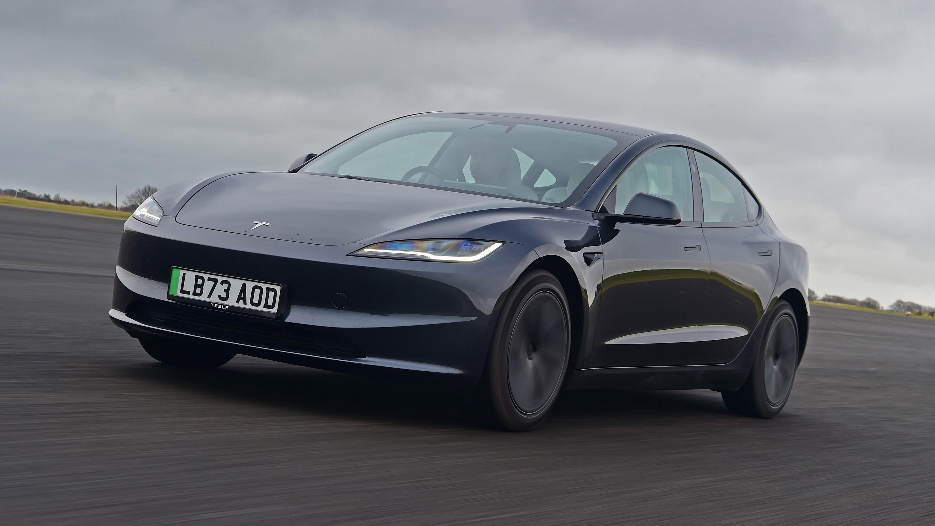 Tesla Model 3 front quarter driving