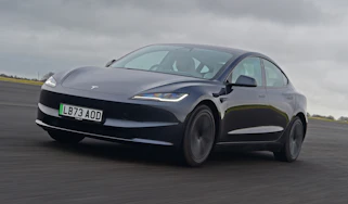 Tesla Model 3 front quarter driving