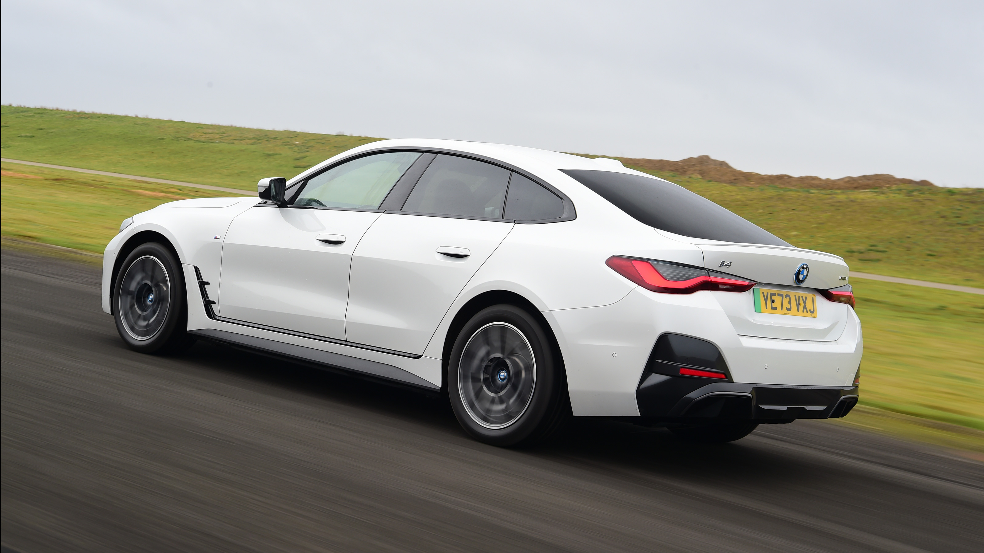 BMW i4 rear quarter driving
