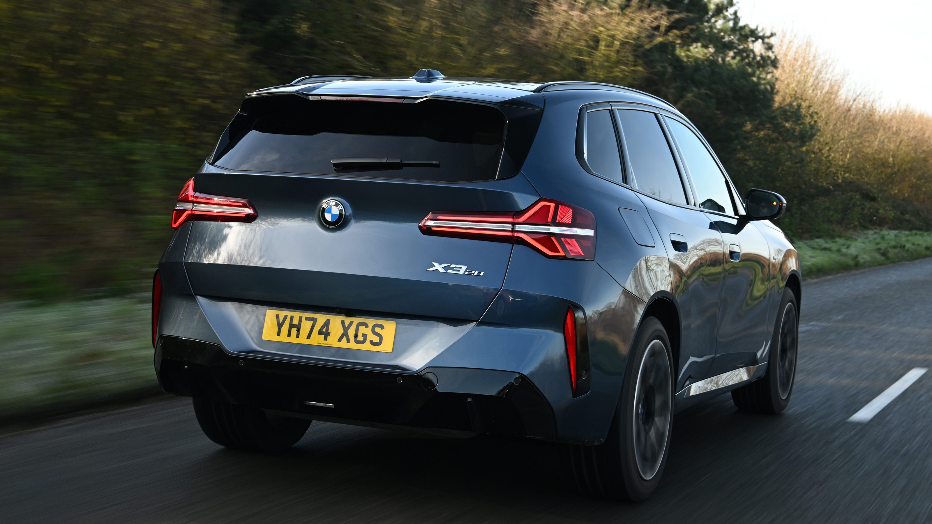 BMW X3 rear quarter driving