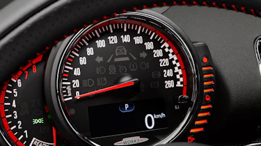 The speedometer, rev counter and fuel gauge sit in a pod in front of the steering wheel