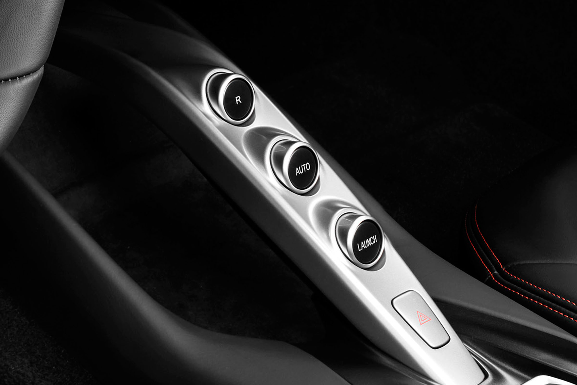 Gear selection is made through these buttons, and paddles behind the steering wheel