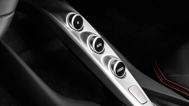 Gear selection is made through these buttons, and paddles behind the steering wheel