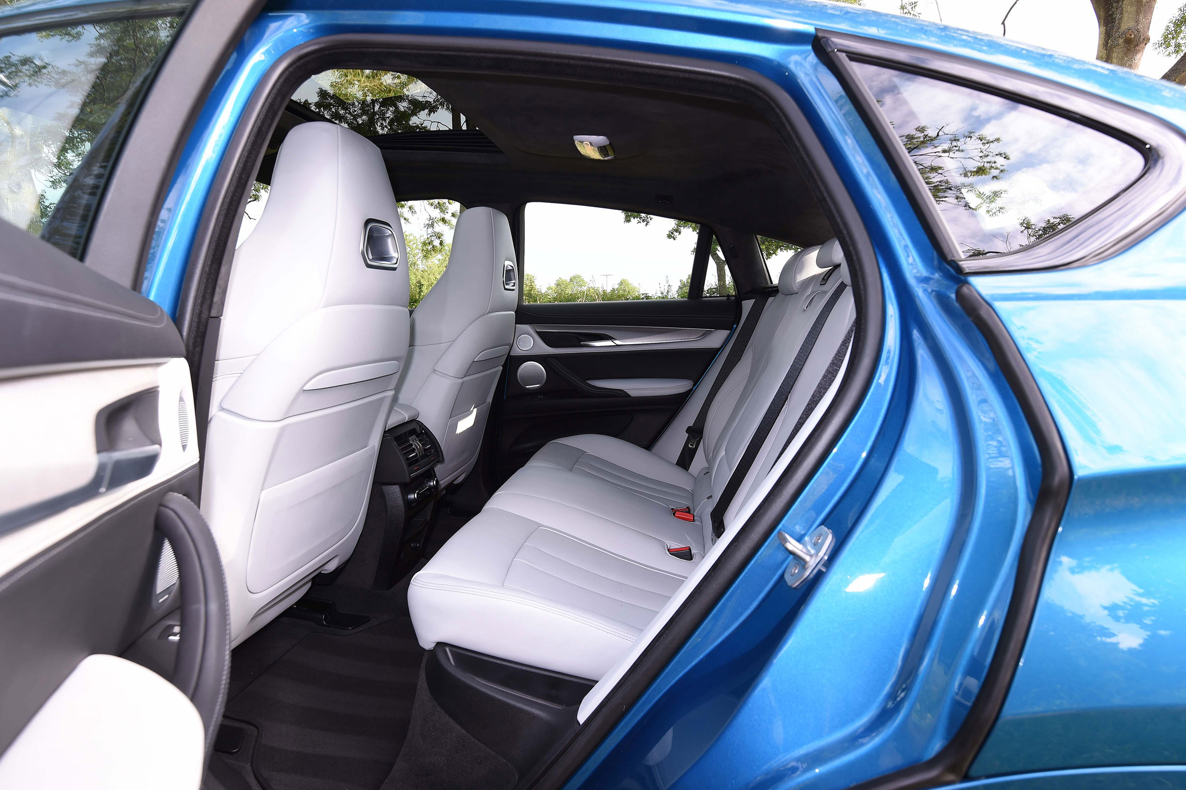Despite its curving roofline, the X6 M still has enough space in the back for three adults