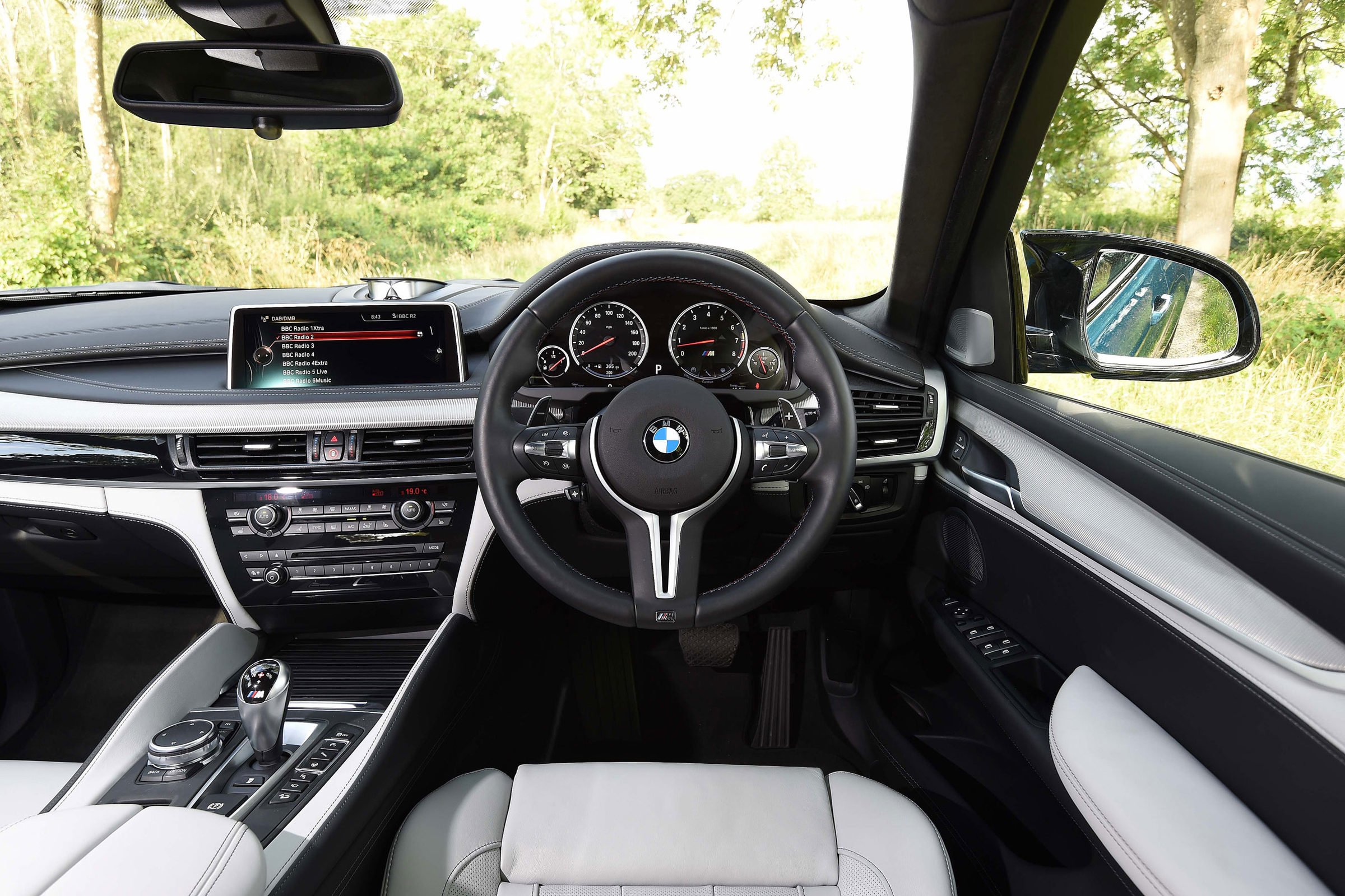 Standard leather upholstery, a sports steering wheel and unique gauges help set the X6 M apart from the regular version