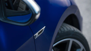 Subtle 'R' badging also serves as a visual giveaway...