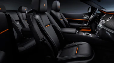 Black leather contrasts with orange highlights to evoke a sunrise