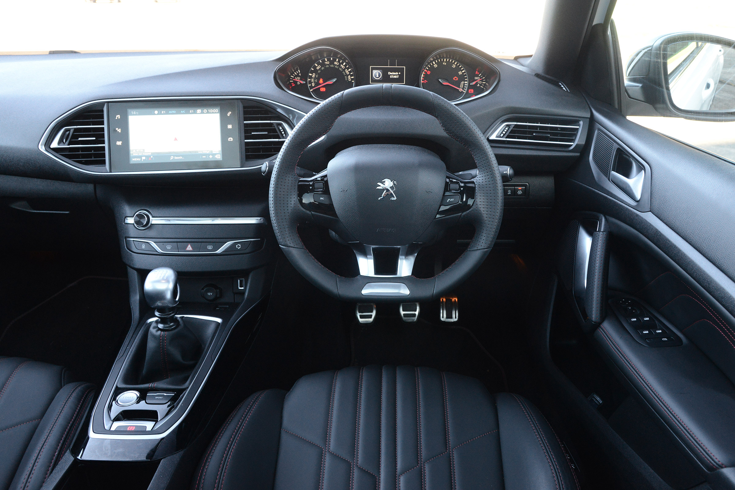 The 308 features the distinctive small steering wheel seen on many modern Peugeots