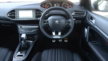 The 308 features the distinctive small steering wheel seen on many modern Peugeots