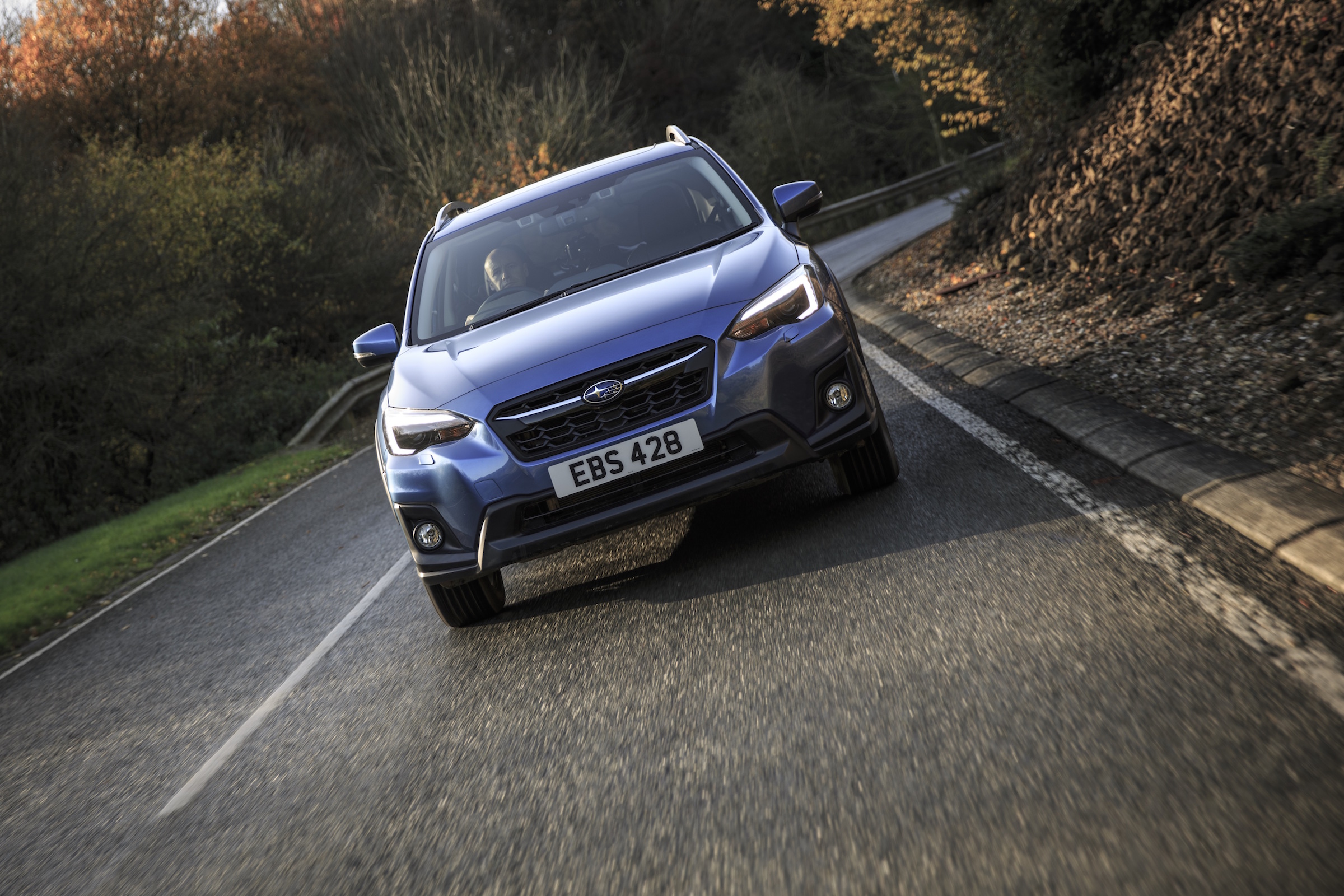 A raised ground clearance, plastic wheelarch cladding and roof rails add to its SUV design cues