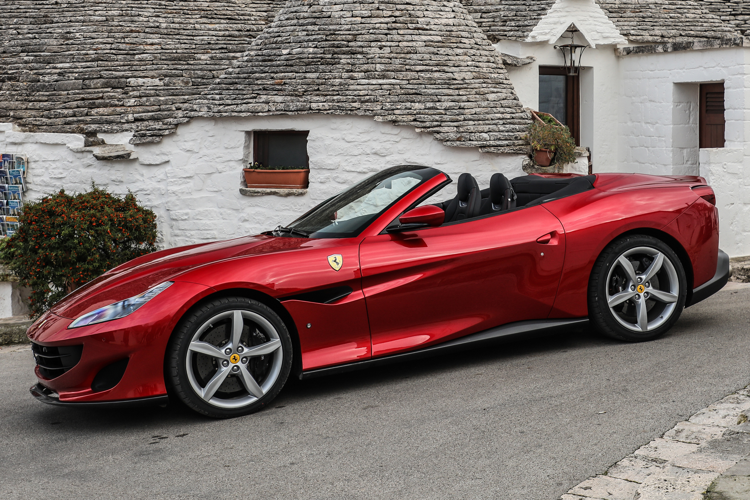 The interior boasts a 10.25-inch infotainment display and digital instruments that flank a yellow rev gauge