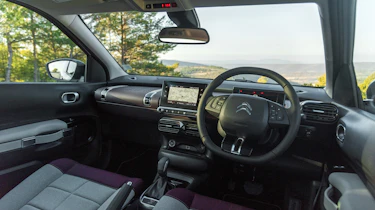 Armchair-like seats further promote laid-back comfort over driving thrills