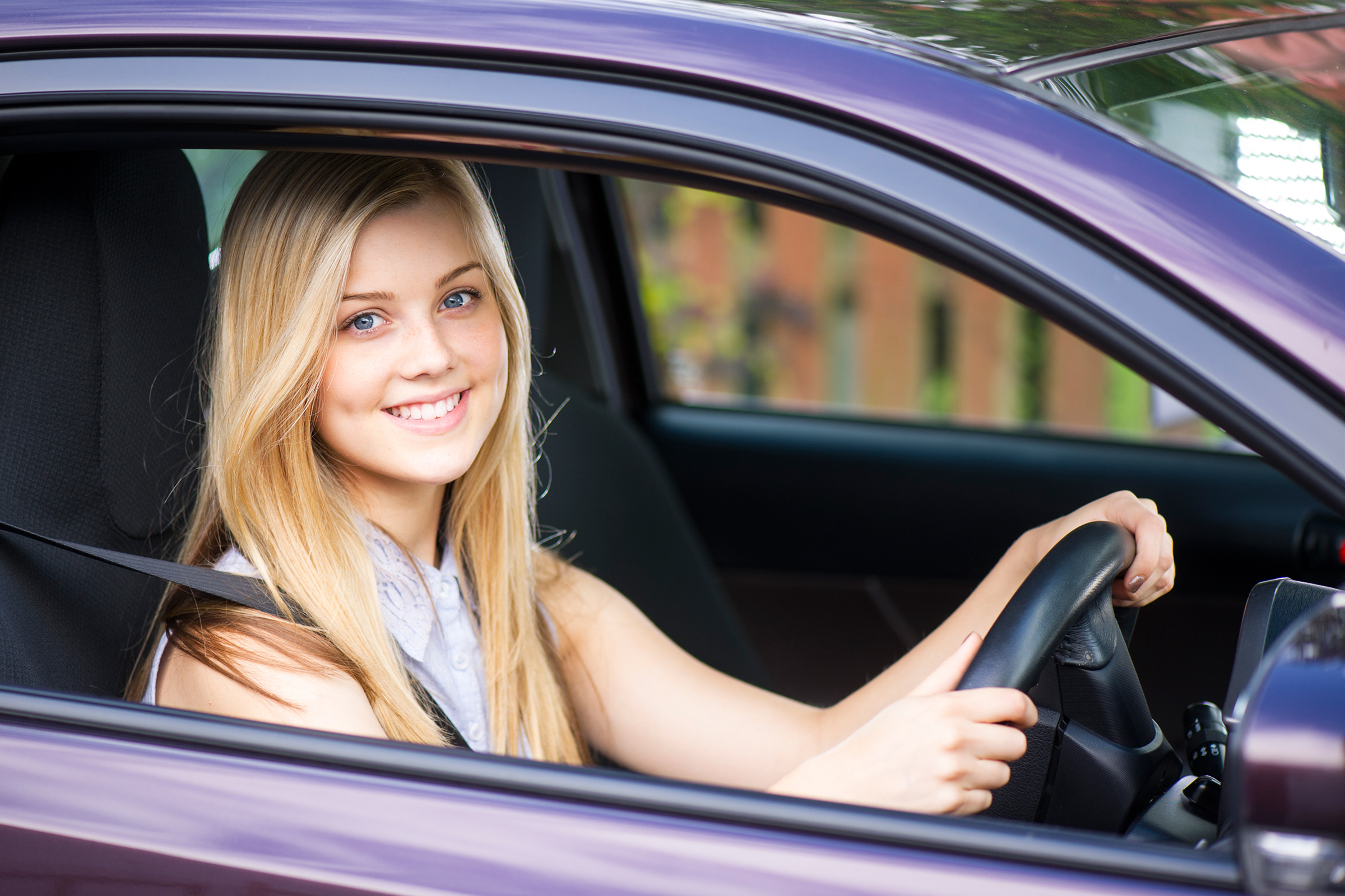 young driver in car