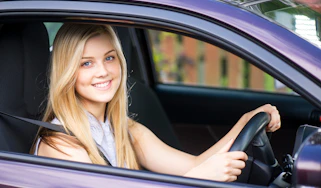 young driver in car