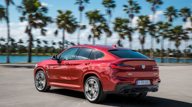BMW X4 tracking shot, rear left