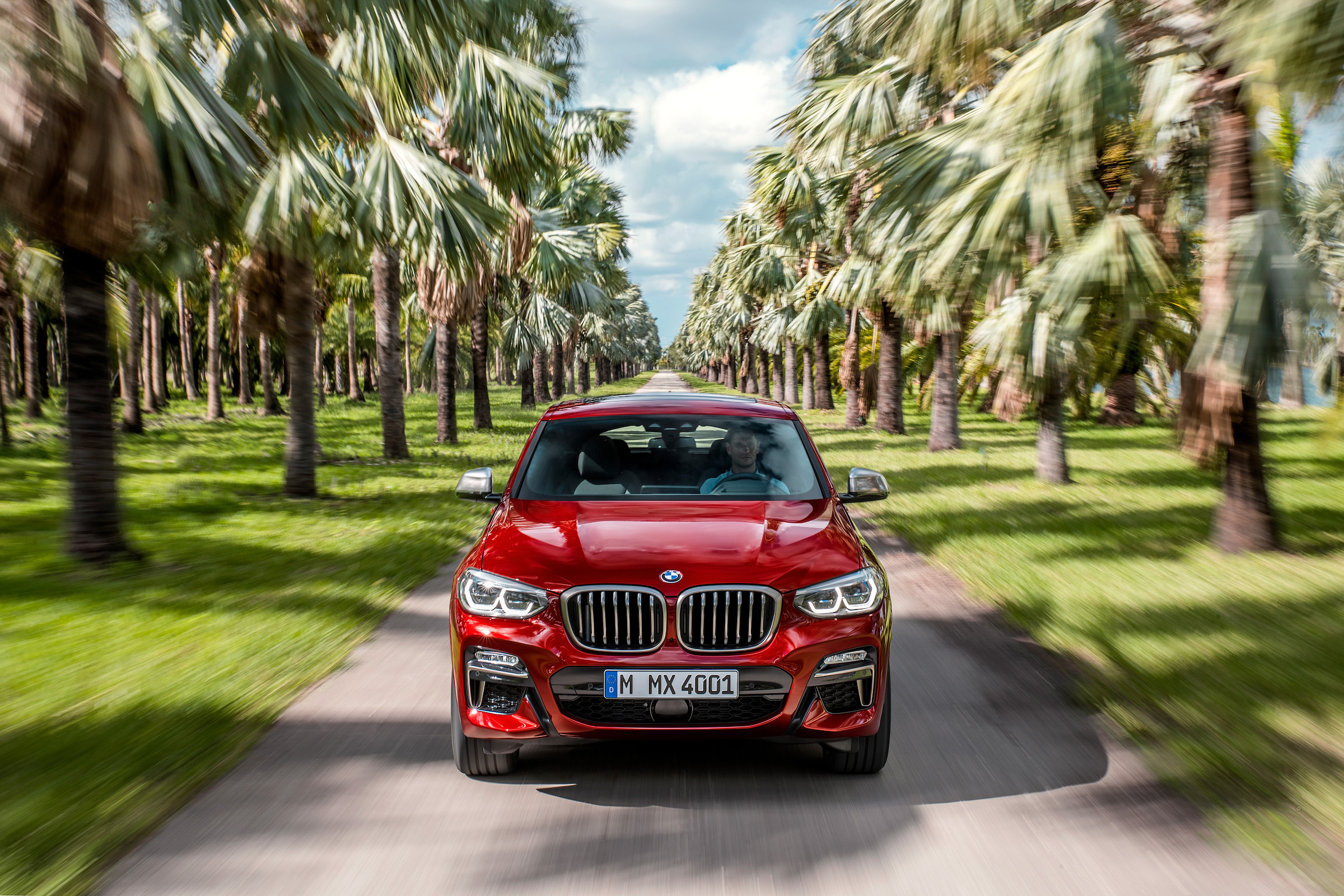 BMW X4 tracking shot, front, head on