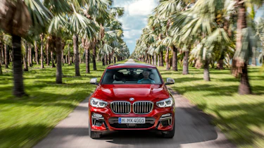 BMW X4 tracking shot, front, head on