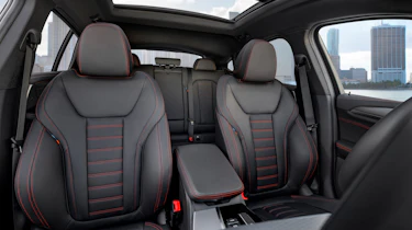BMW X4 interior shot, front seats, looking towards back