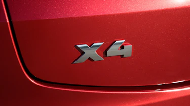 BMW X4 exterior detail shot, X4 badge
