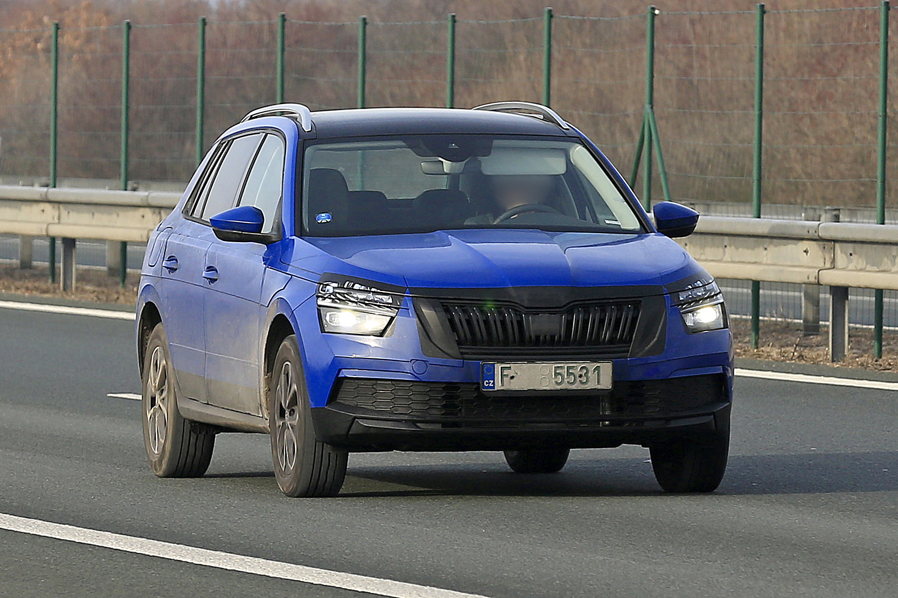 Skoda Kamiq in camouflage driving