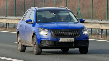 Skoda Kamiq in camouflage driving