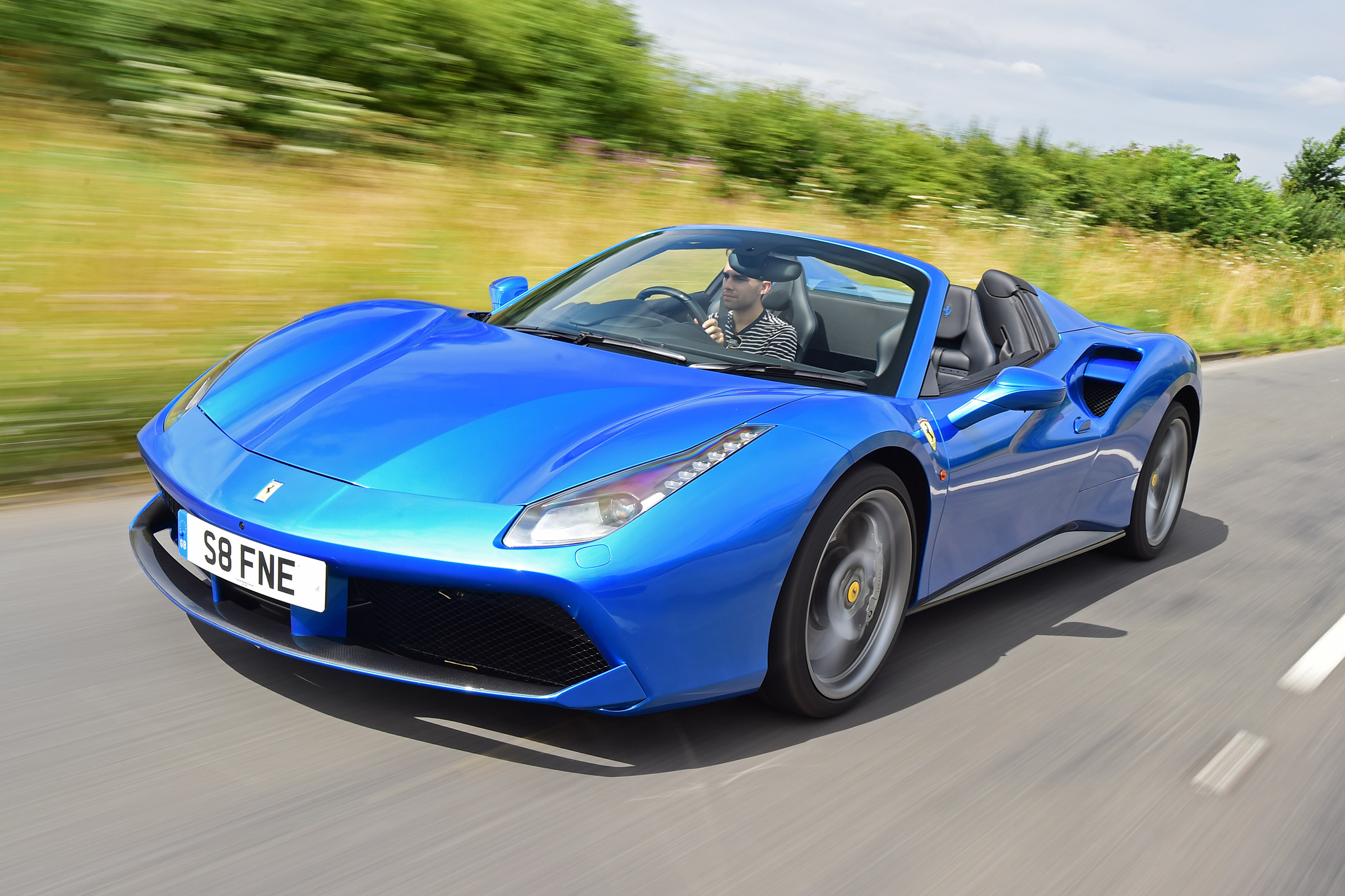 Ferrari 488 Spider convertible front driving