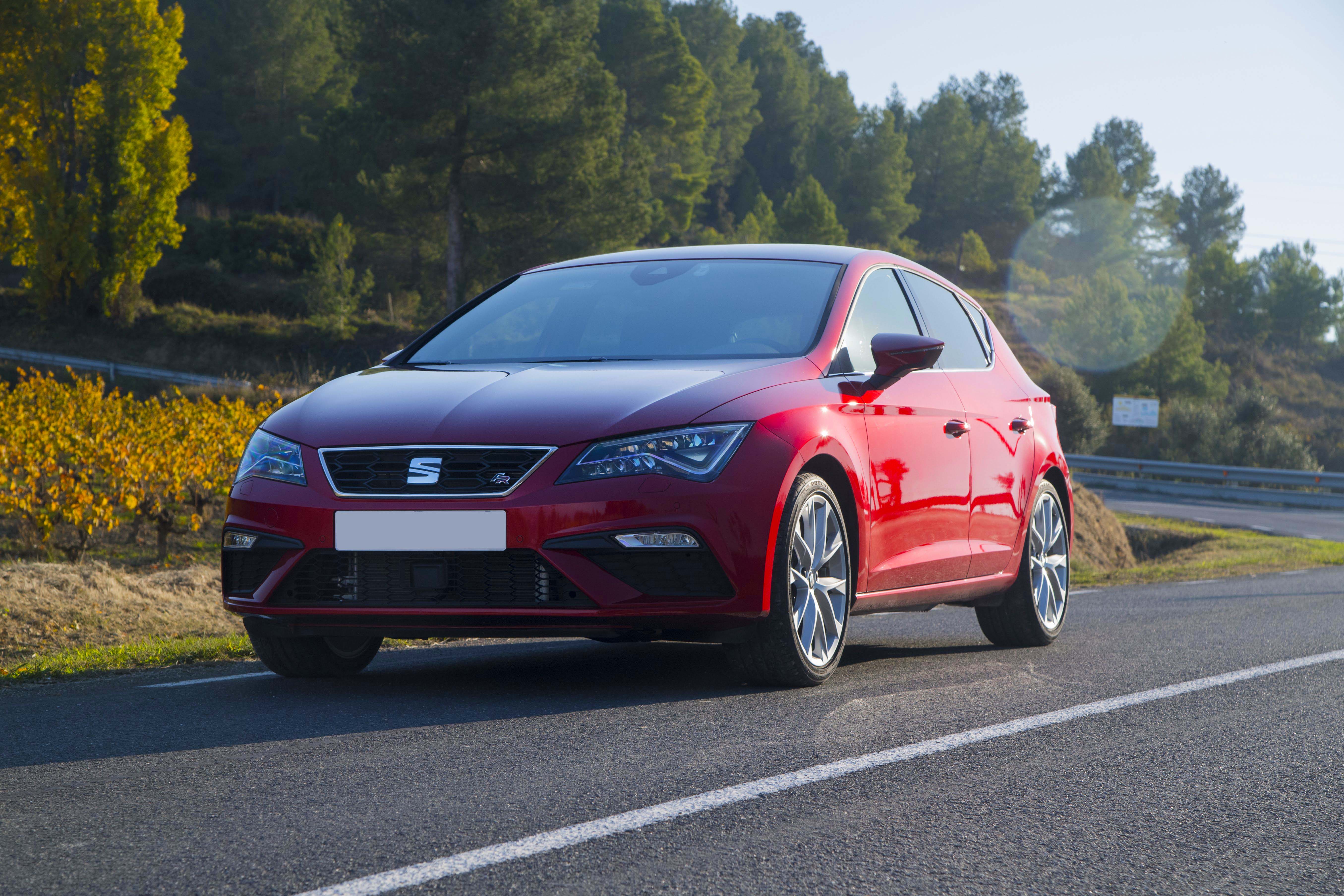 Red SEAT Leon FR driving