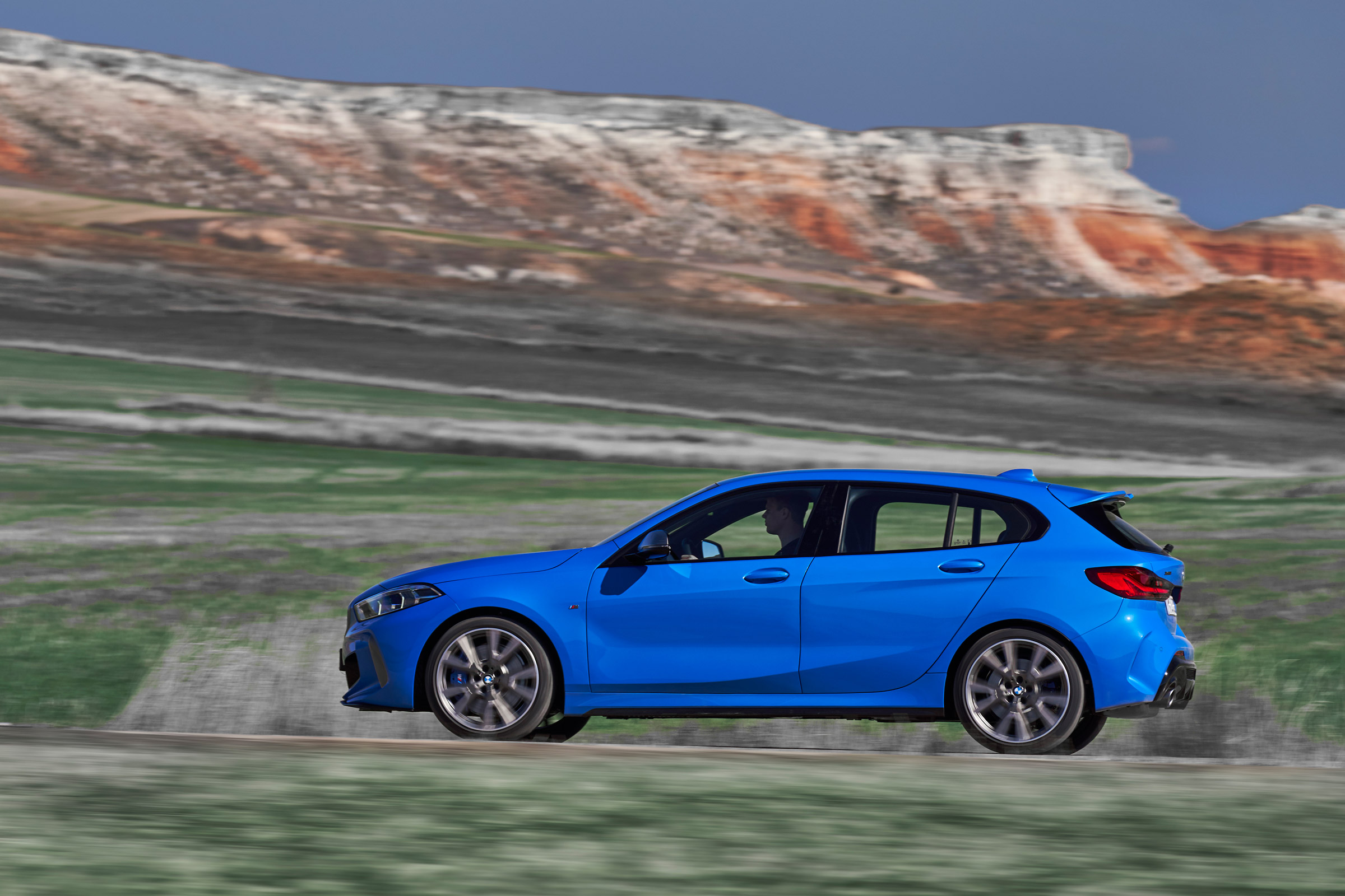 2019 BMW 1 Series M135i xDrive side panning view