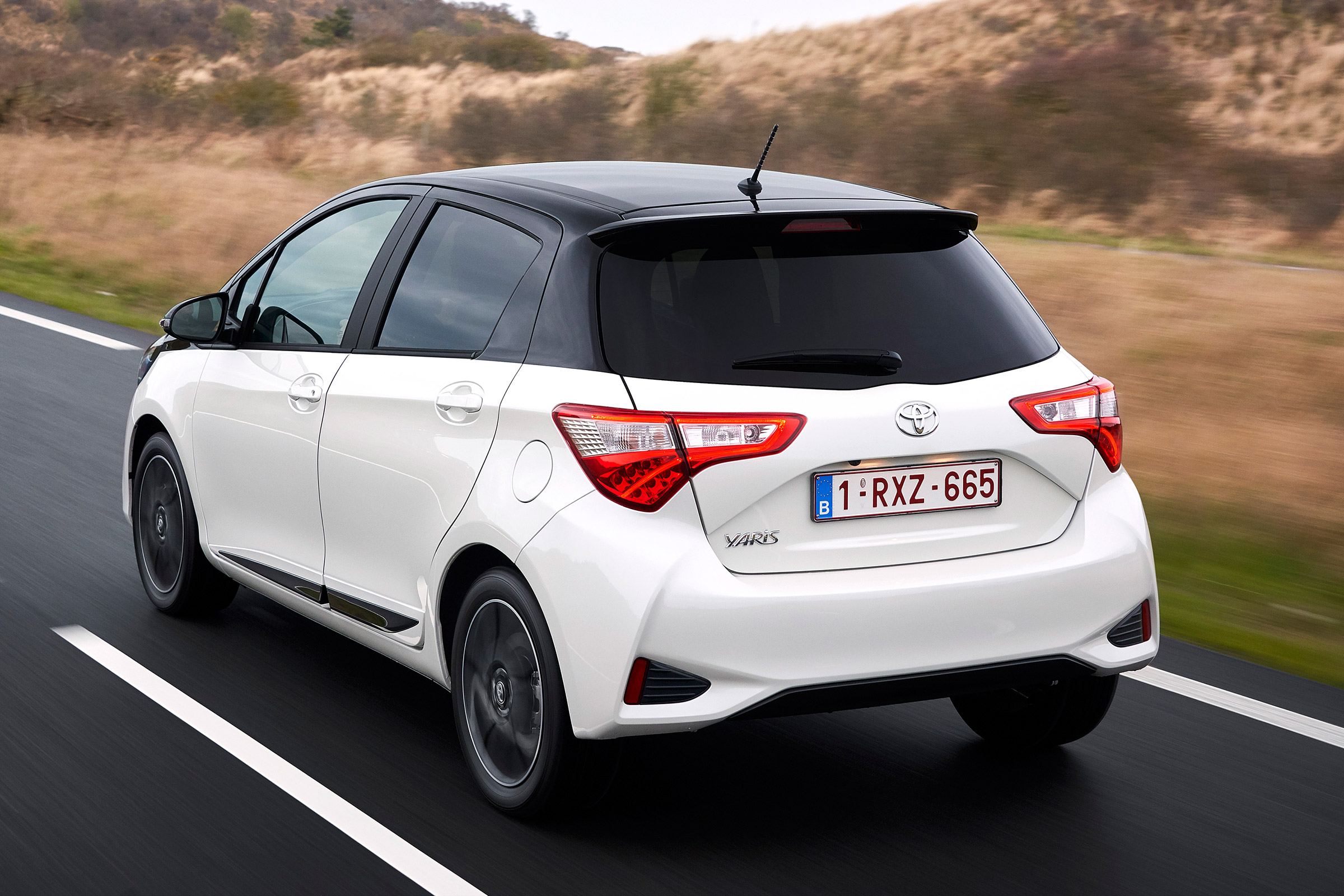 Toyota Yaris driving away from camera