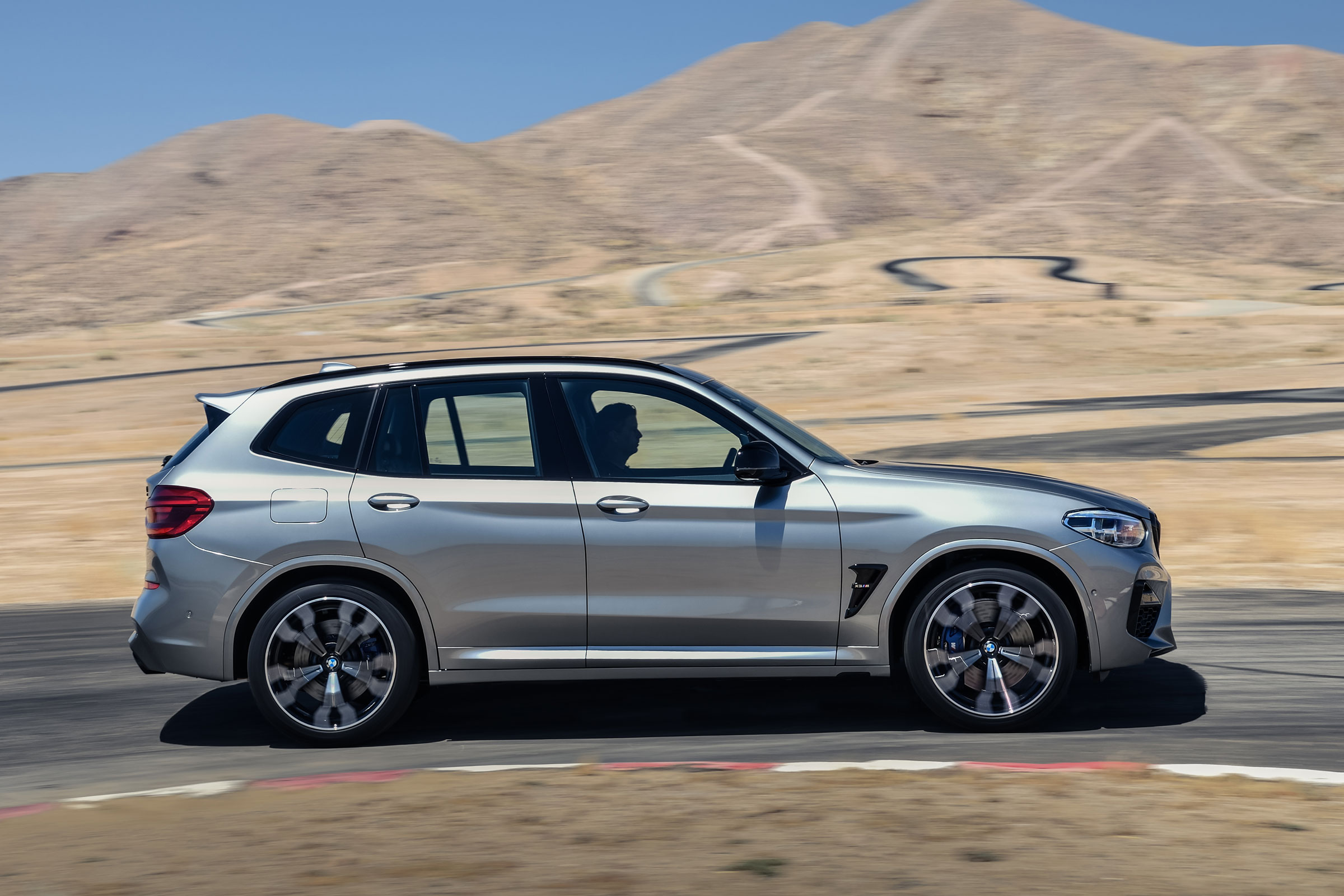 BMW X3 M Competition SUV side panning on track