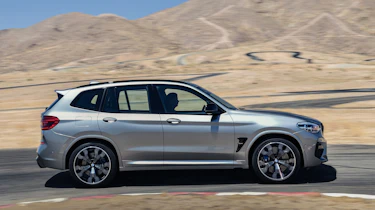 BMW X3 M Competition SUV side panning on track