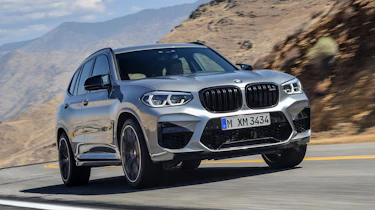 BMW X3 M Competition SUV front 3/4 road