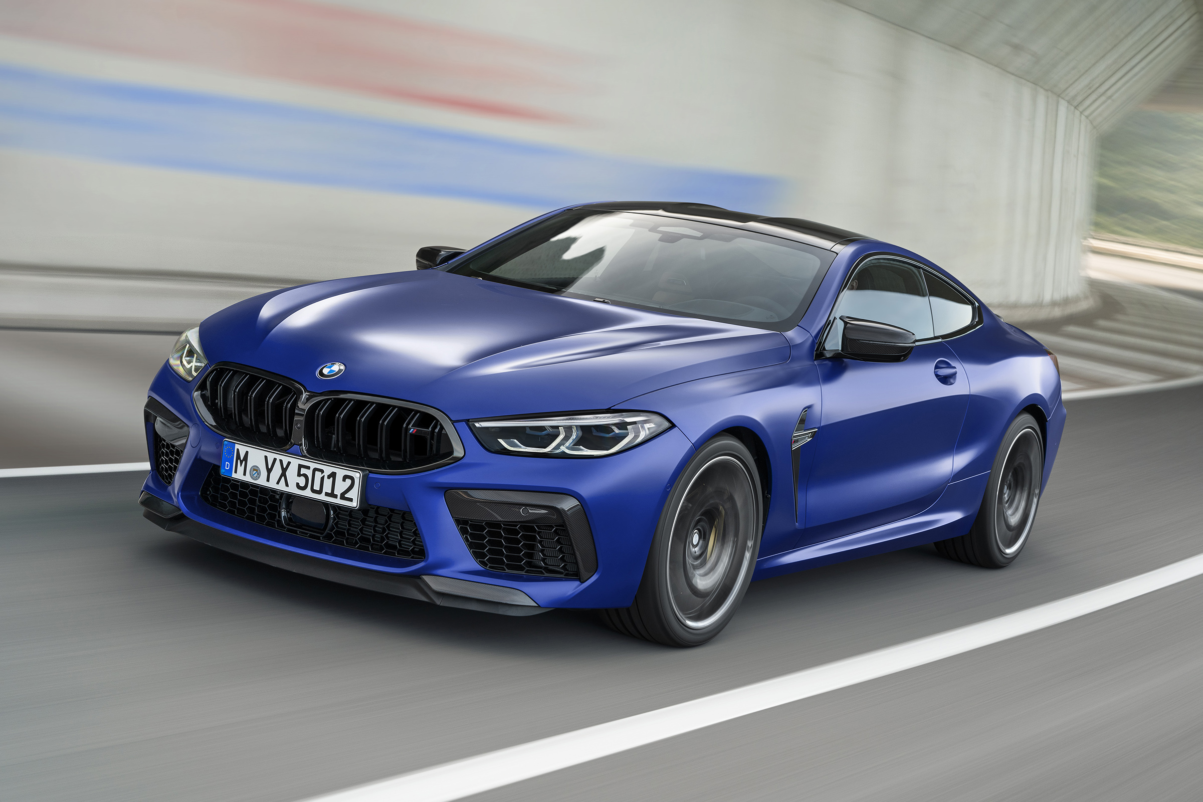 BMW M8 Competition coupe - front 3/4 driving 