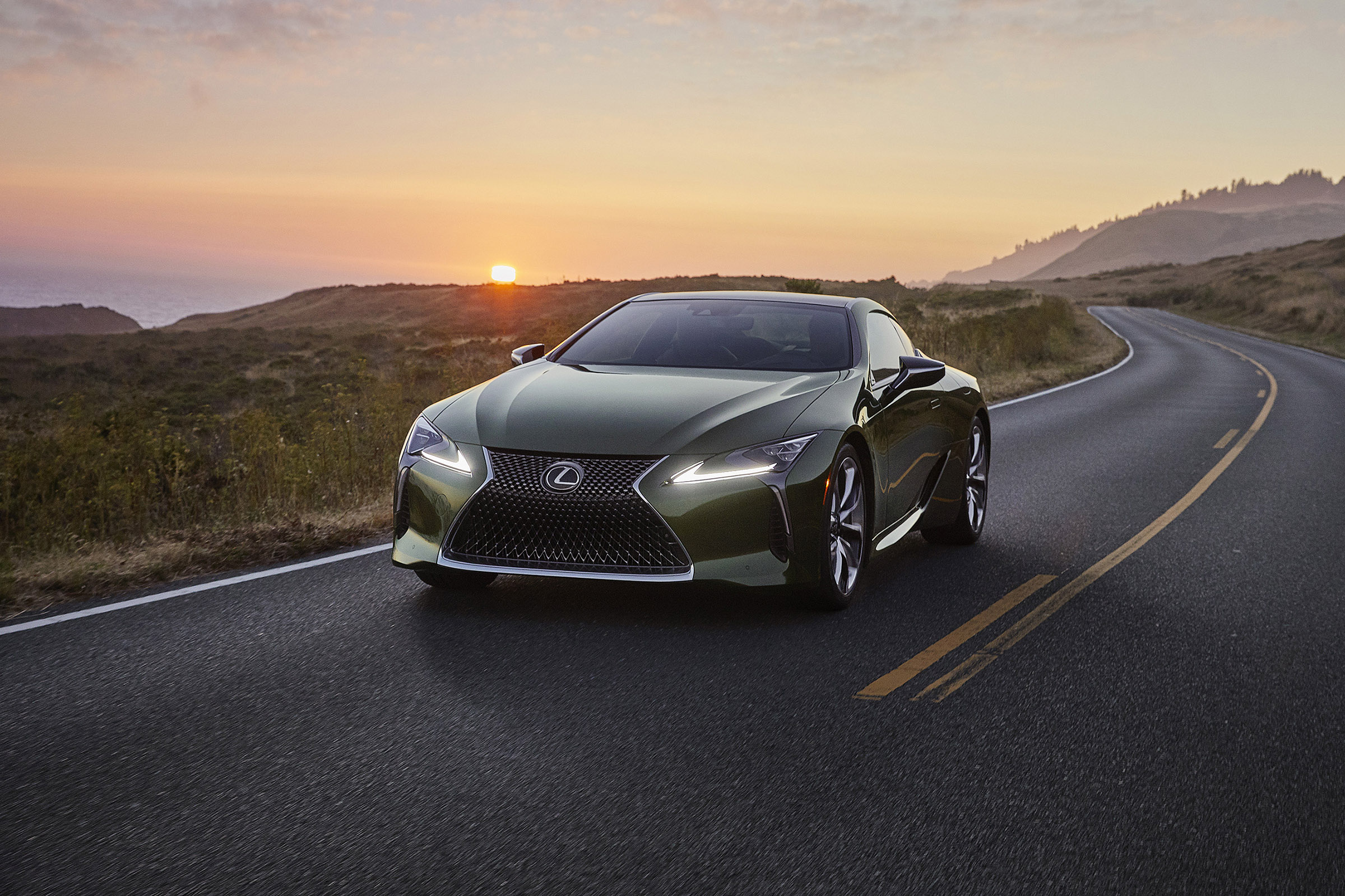 Lexus LC Limited Edition driving in front of sunset