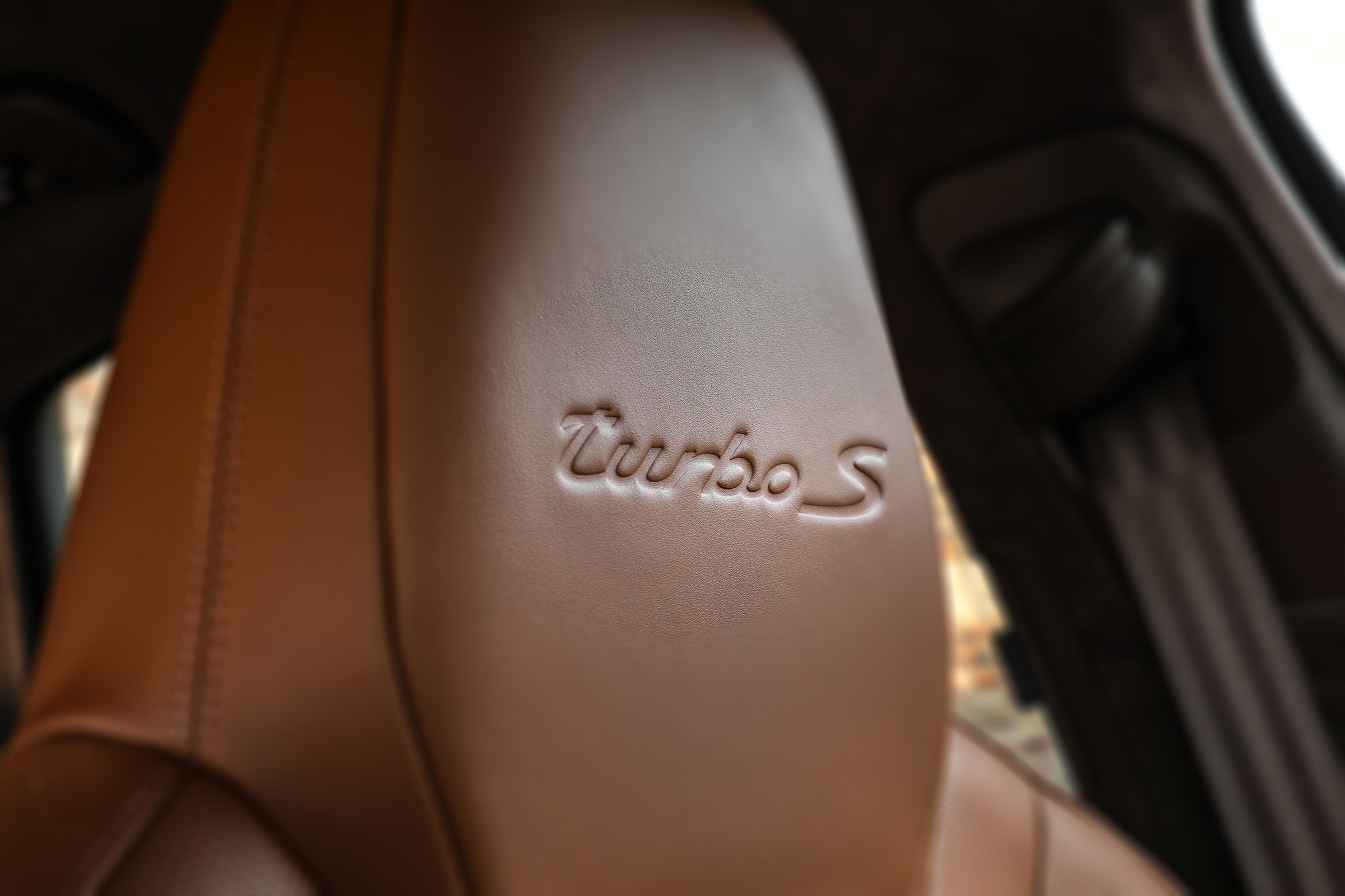 Porsche Cayenne Turbo S E-Hybrid turbo logo on seat