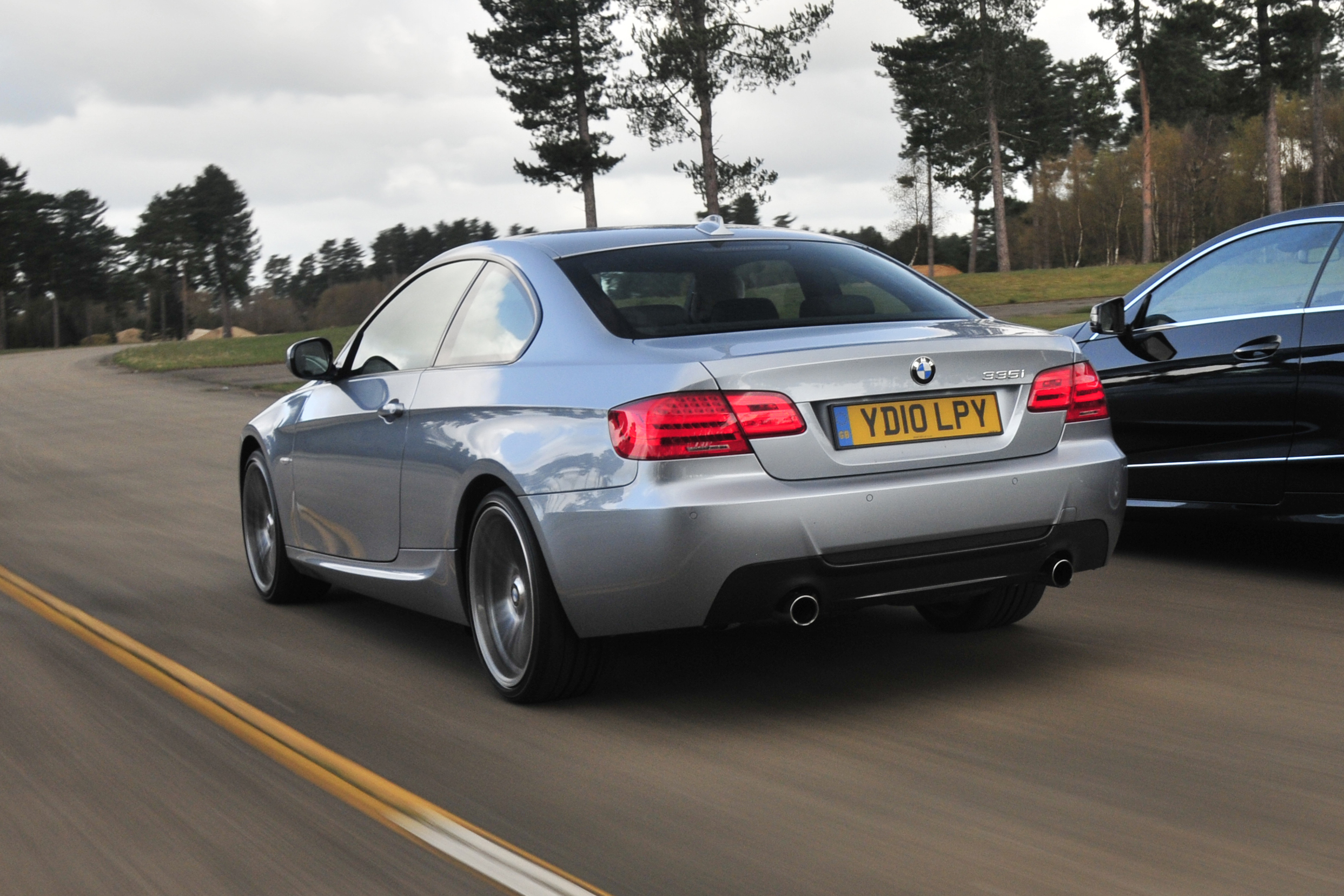 BMW 3 Series Coupe -  rear 3/4 driving 