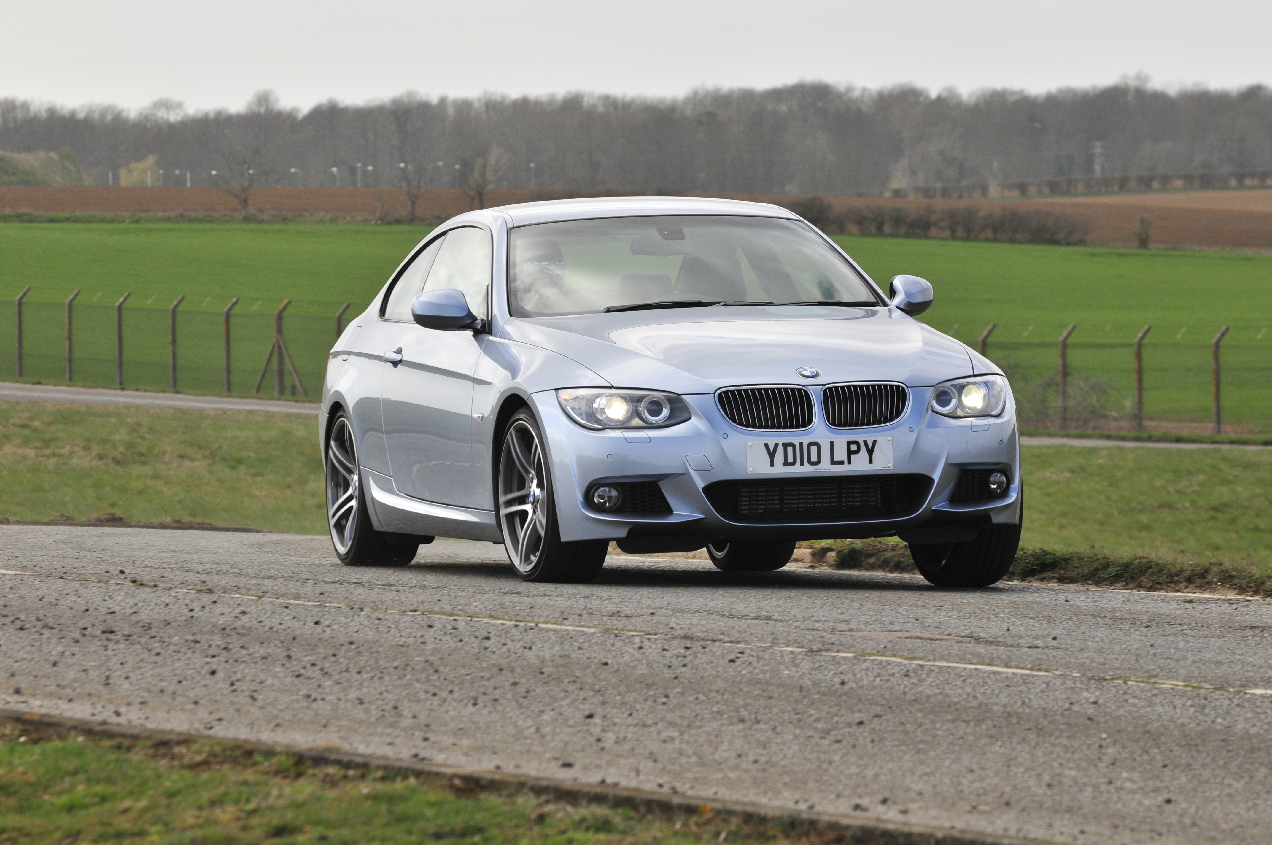 BMW 3 Series Coupe -  front 3/4 driving 