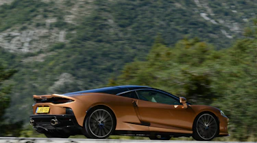 McLaren GT driving past camera