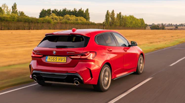 BMW M135i xDrive - dynamic rear 3/4 view