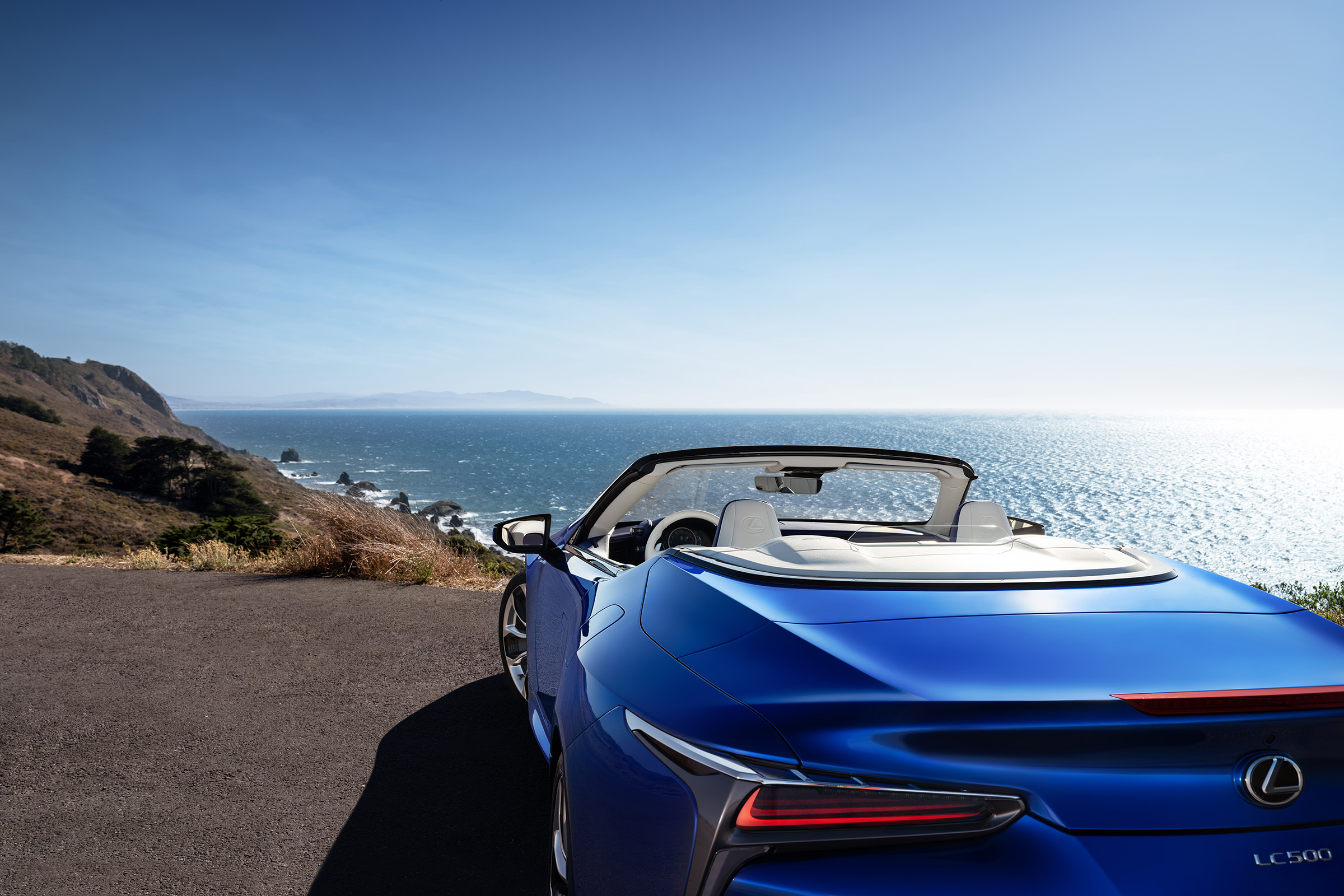Lexus LC500 Convertible parked on cliff - roof down