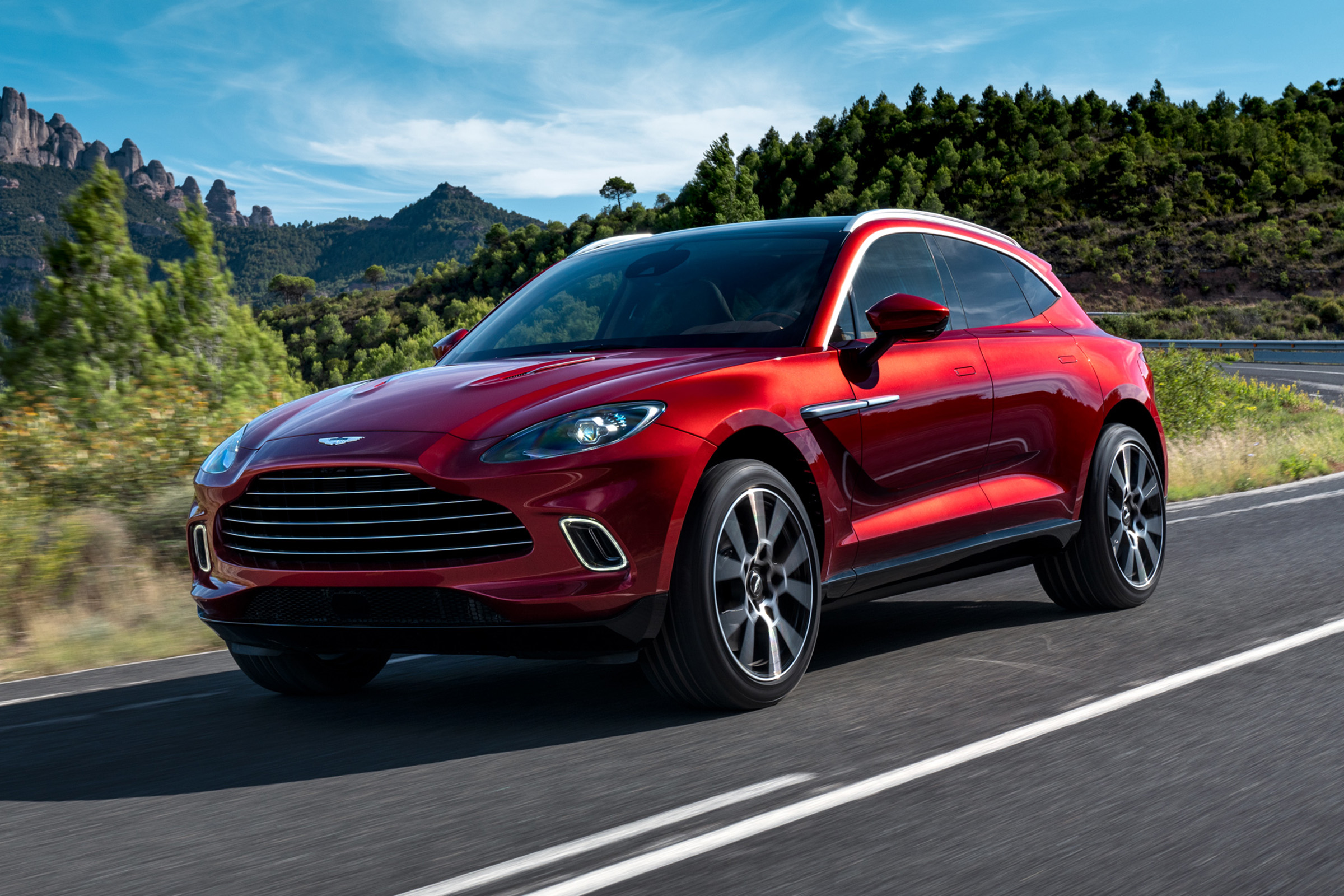 Aston Martin DBX driving - close up of front view