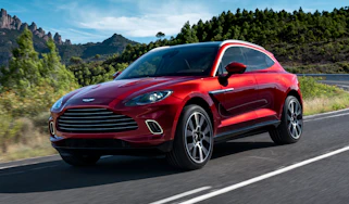 Aston Martin DBX driving - close up of front view