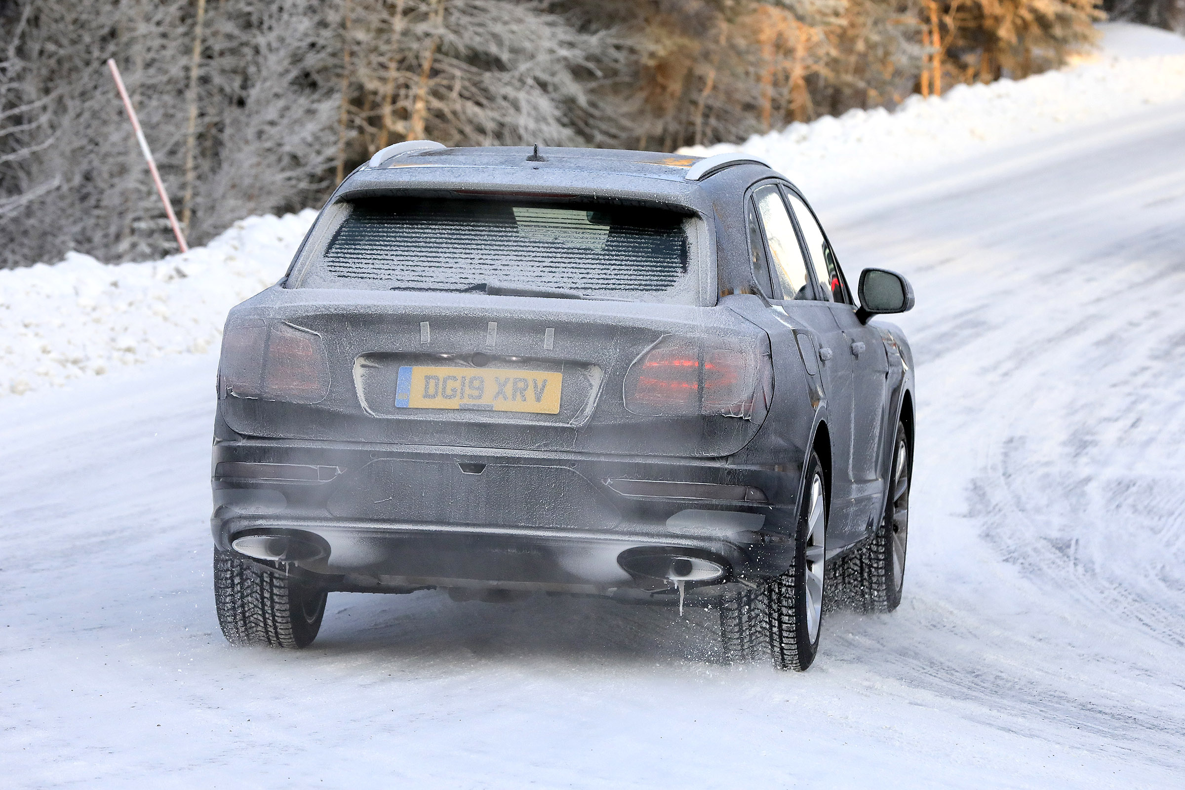 Bentley Bentayga development model driving away from camera